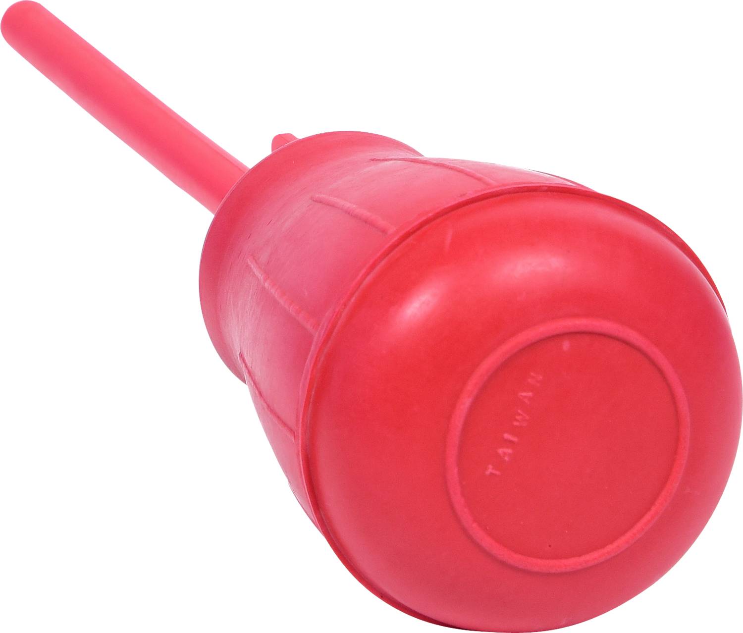 A red rubber suction cup lying on a white background.