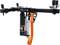 A KS Tools motor traverse tool with a black traverse and orange strap, used for securely fastening engines.