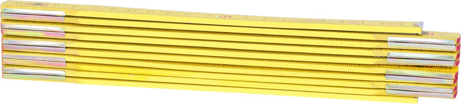 A yellow folding ruler, folded, lies on a white background. It is mostly used for measuring lengths.