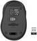 Black wireless computer mouse with detachable USB receiver and battery compartment. Underside featuring product information and logo.