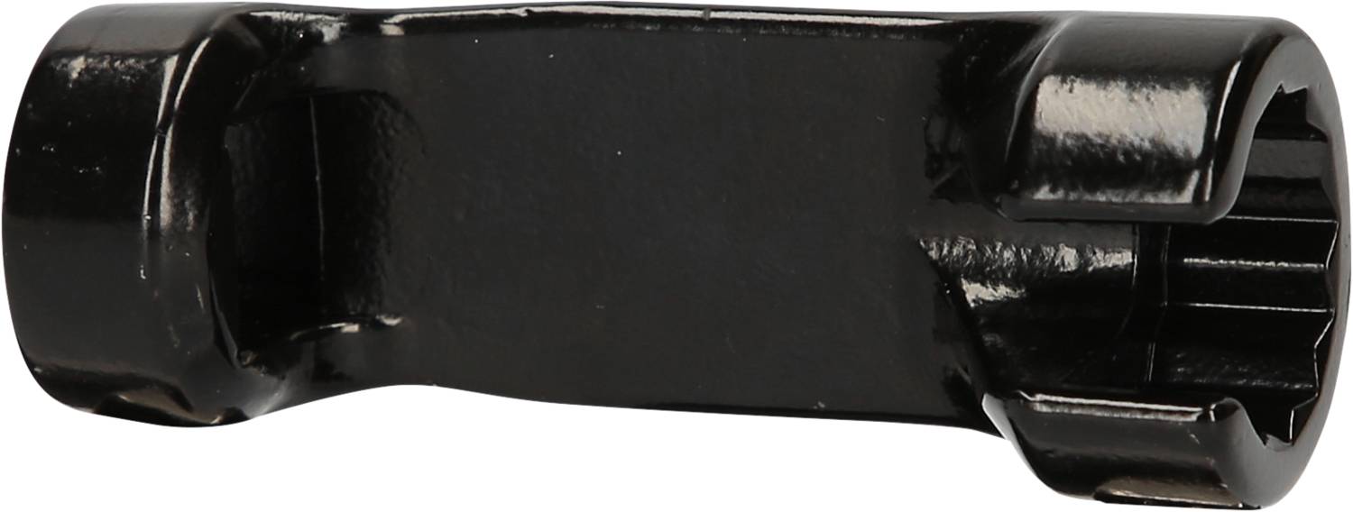 Black, cylindrical spanner with an open side and hexagonal internal opening. Tool for loosening nuts.