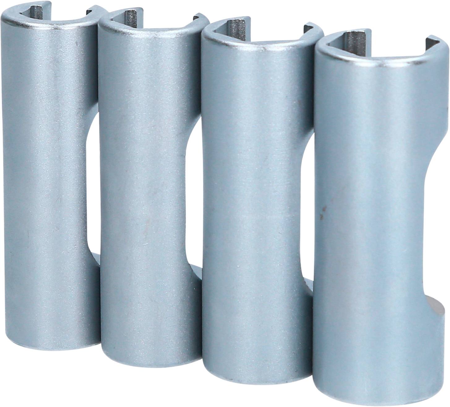 Four silver metal clips stand side by side in a row, showing their rounded opening upwards.