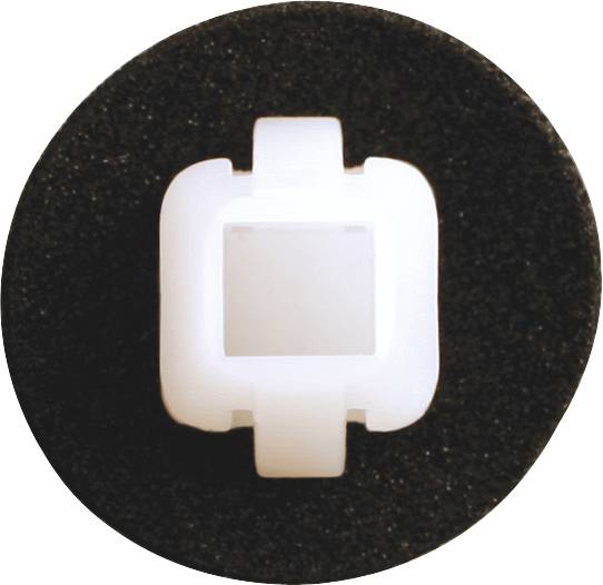 White, square plastic mounting bracket on a black, circular background.