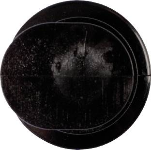 Black, round power button with a clearly visible marking line.