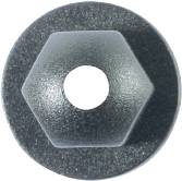 A hexagonal nut with a hole in the centre, lying on a flat surface.