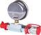A pressure gauge with a circular dial and two red protective caps on the connections. Primarily used for pressure measurements.