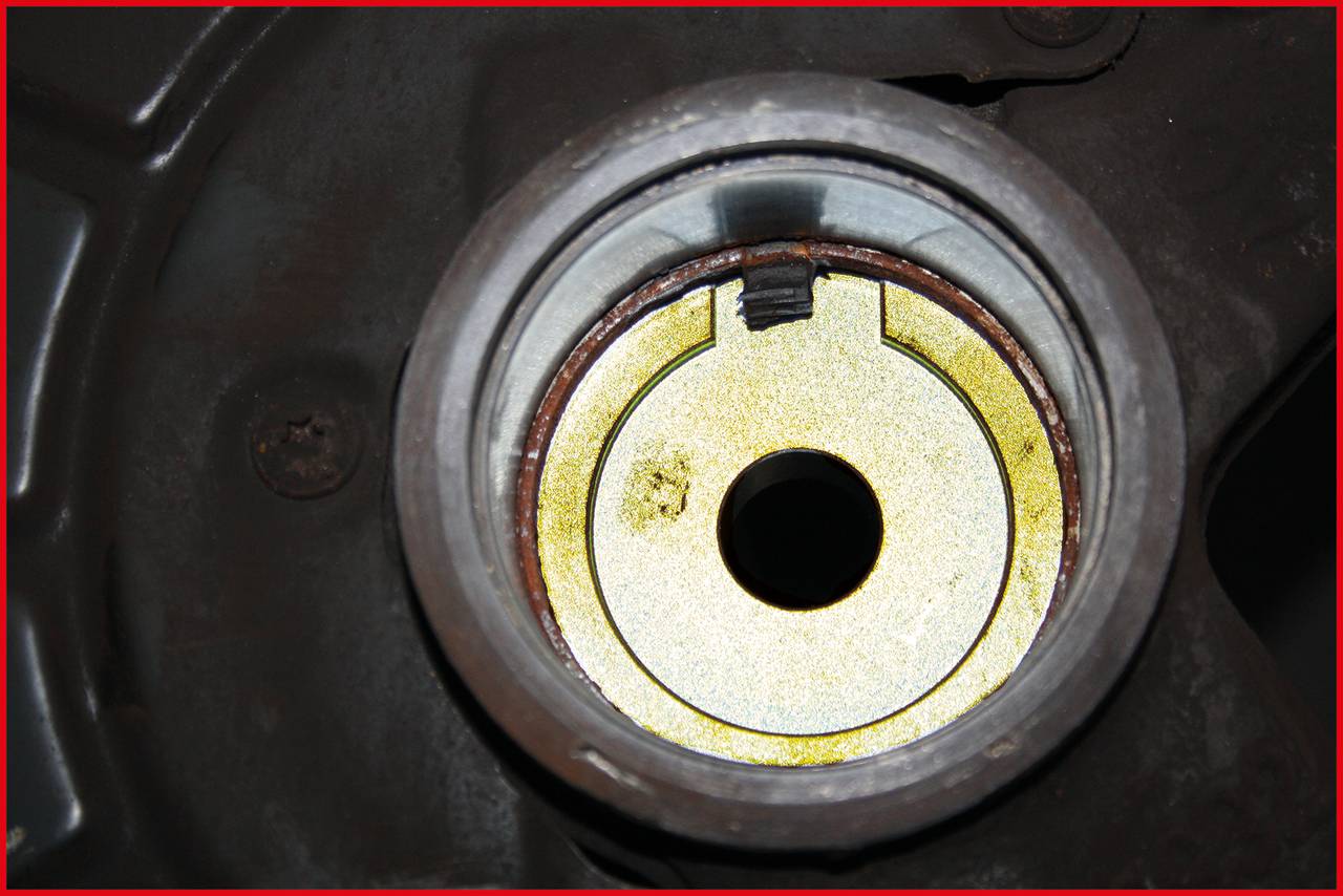 'Close-up of a metal cylinder with a hole in the centre, surrounded by a red frame.'