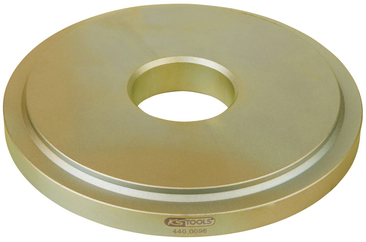A gold-coloured metal disc with a central hole, used as a tool attachment. 'KS TOOLS 440.0096' marking visible.