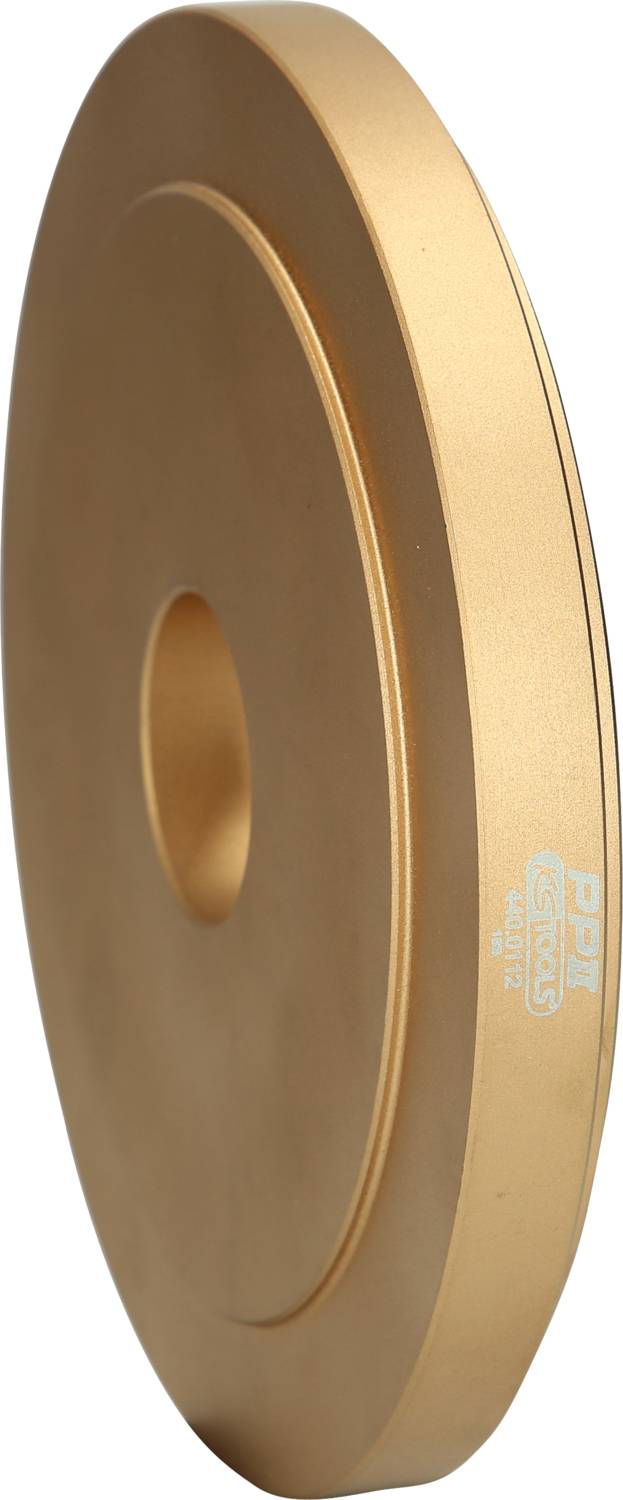 Golden grinding disc, viewed from the side, with central bore.