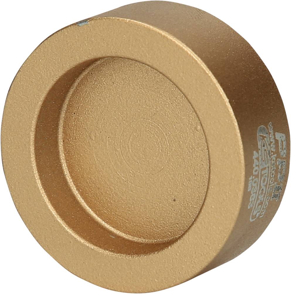 A golden, round metal cylinder with engraved markings on its side.