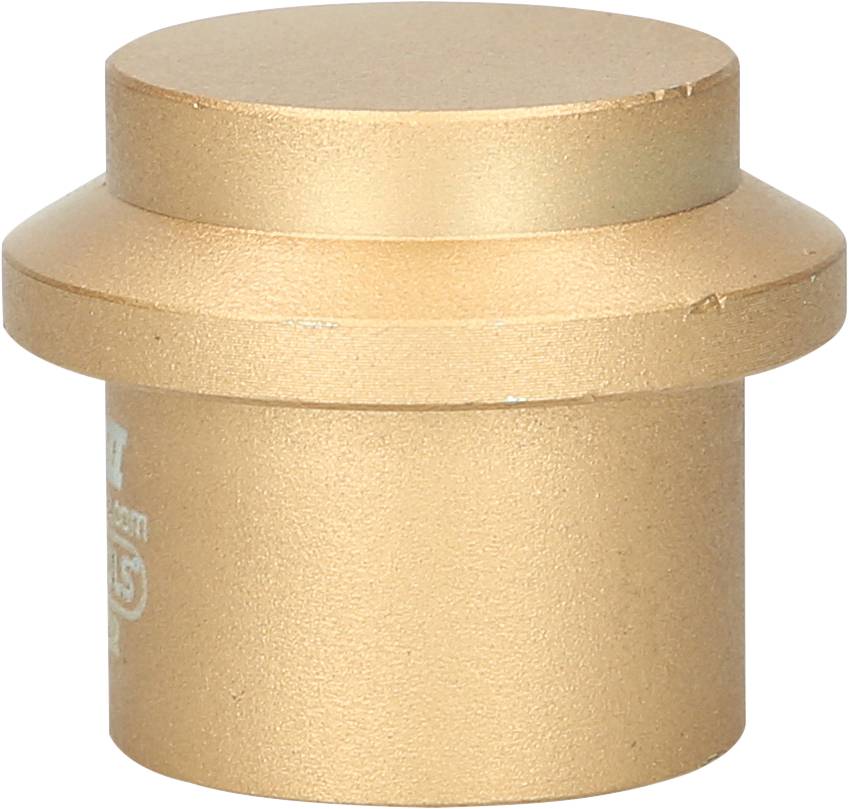 Golden cylindrical metal cap that is likely used as a cover or seal for a pipe or opening.
