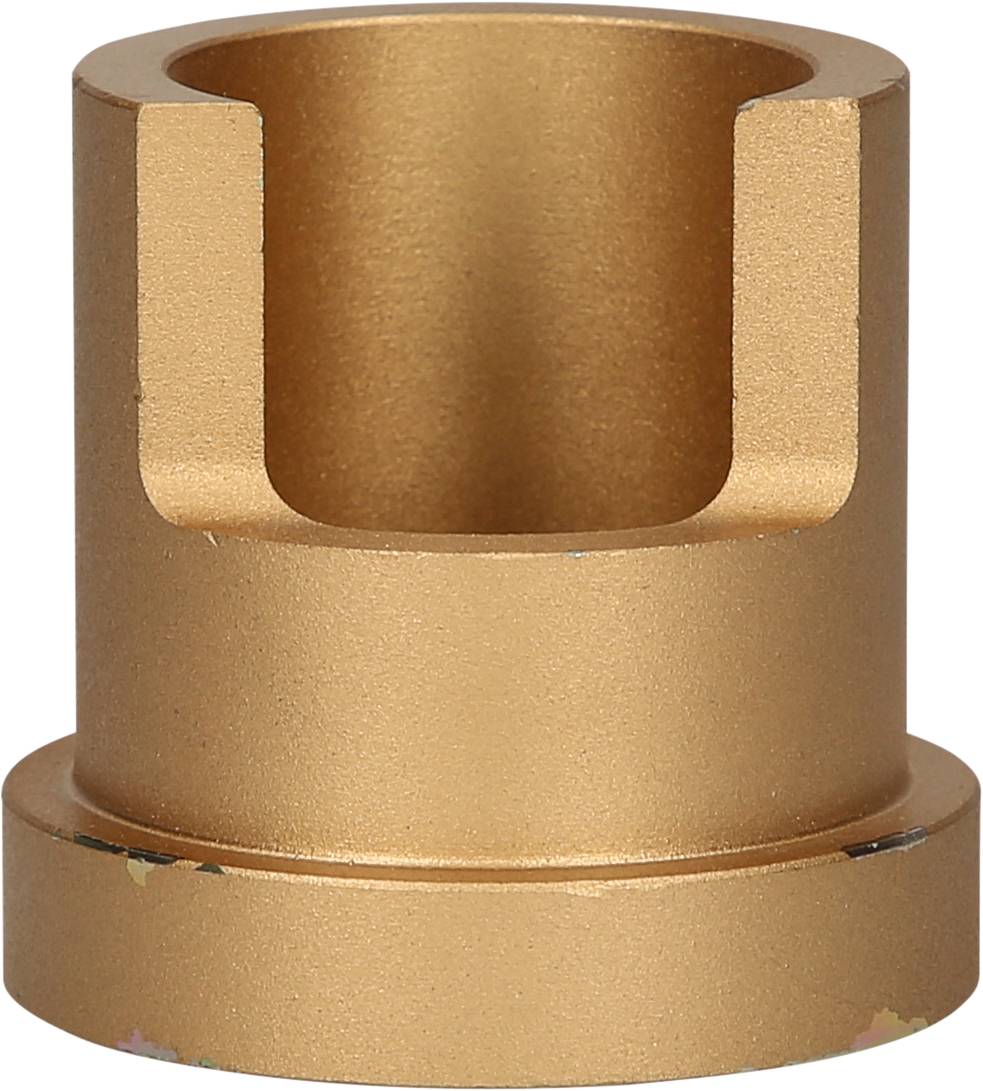 A cylindrical, golden metal part with a wide slot at the top. Used in machinery or mechanical applications.