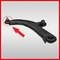 A black wishbone suspension arm with a ball joint, highlighted by a red arrow, against a grey background.
