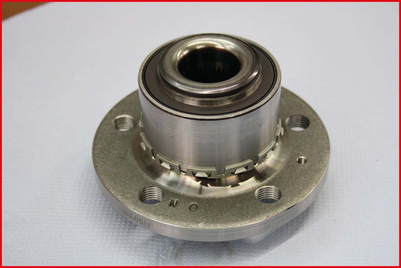 A silver ball bearing on a white background, showing fine details of the metal construction and precise craftsmanship.