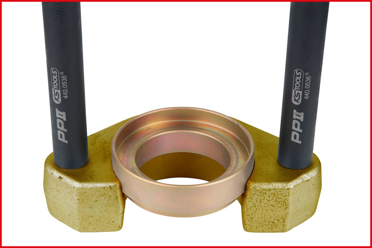 Two black rods support a golden metal ring on a golden base. Hand tool for specific technical applications.