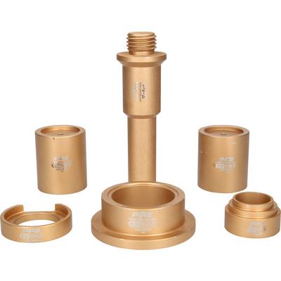 Five golden bicycle bearing adapters in various sizes, symmetrically arranged; central adapter is the tallest.