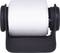 White textile tape roll on a black plastic holder.