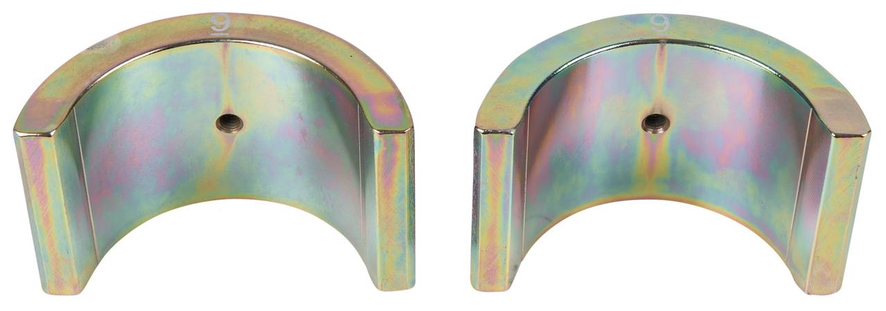 Two metallic semicircles with a shiny surface, placed side by side.