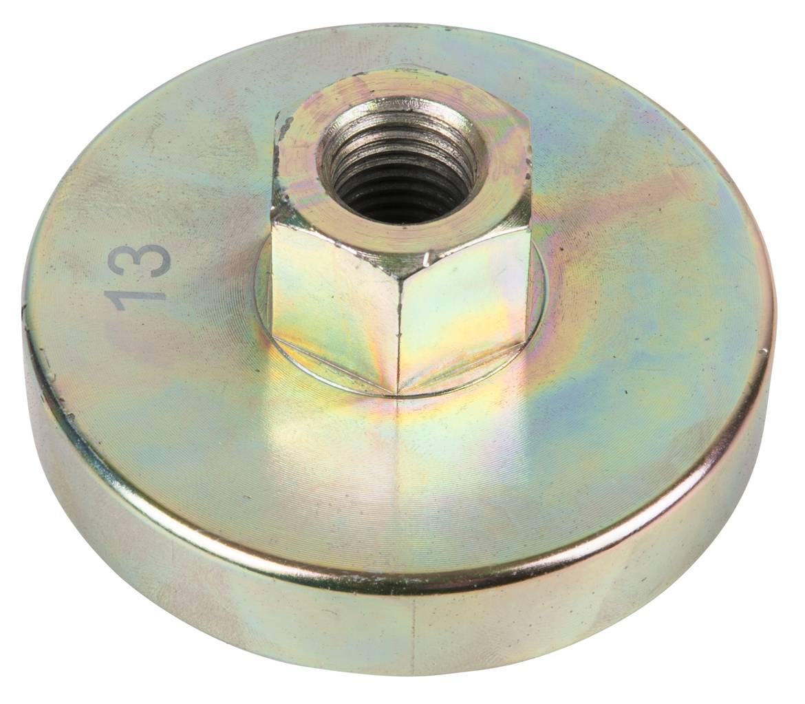 A round metal plate with a central, recessed hexagonal bolt. The number '13' is engraved on the plate.