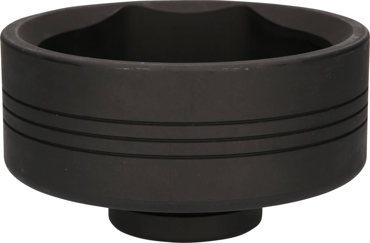 A black, round ashtray with several grooves on the exterior.