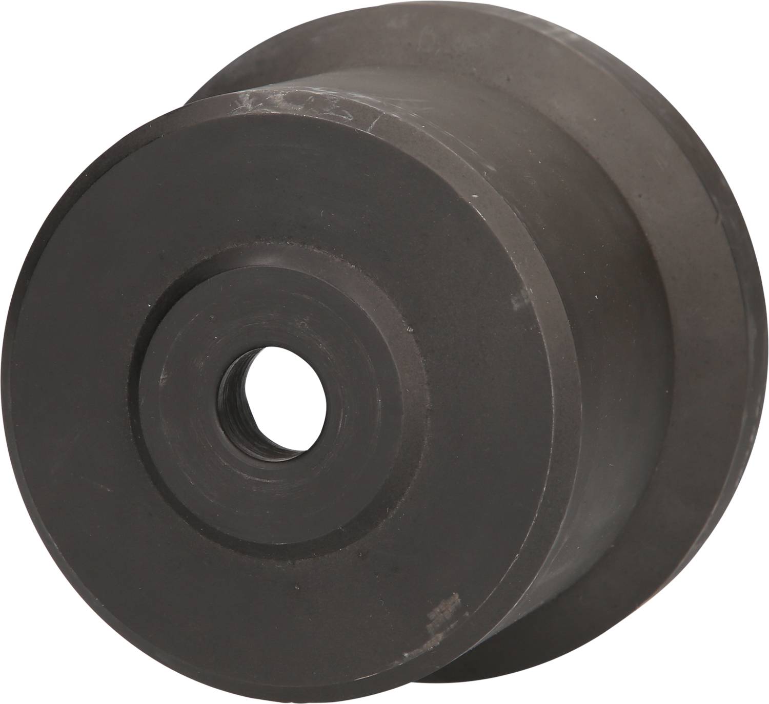 A grey cylindrical metal part with a central hole, possibly a machine or vehicle component.