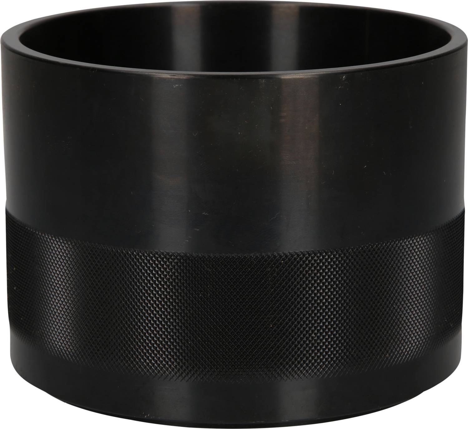 A black, cylindrical cup with a knurled grip area for better handling, sits on a light surface.