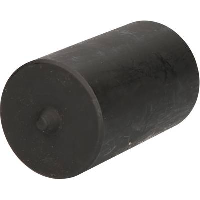 A black cylinder with one flat and one slightly curved side lies at an angle on a white surface.