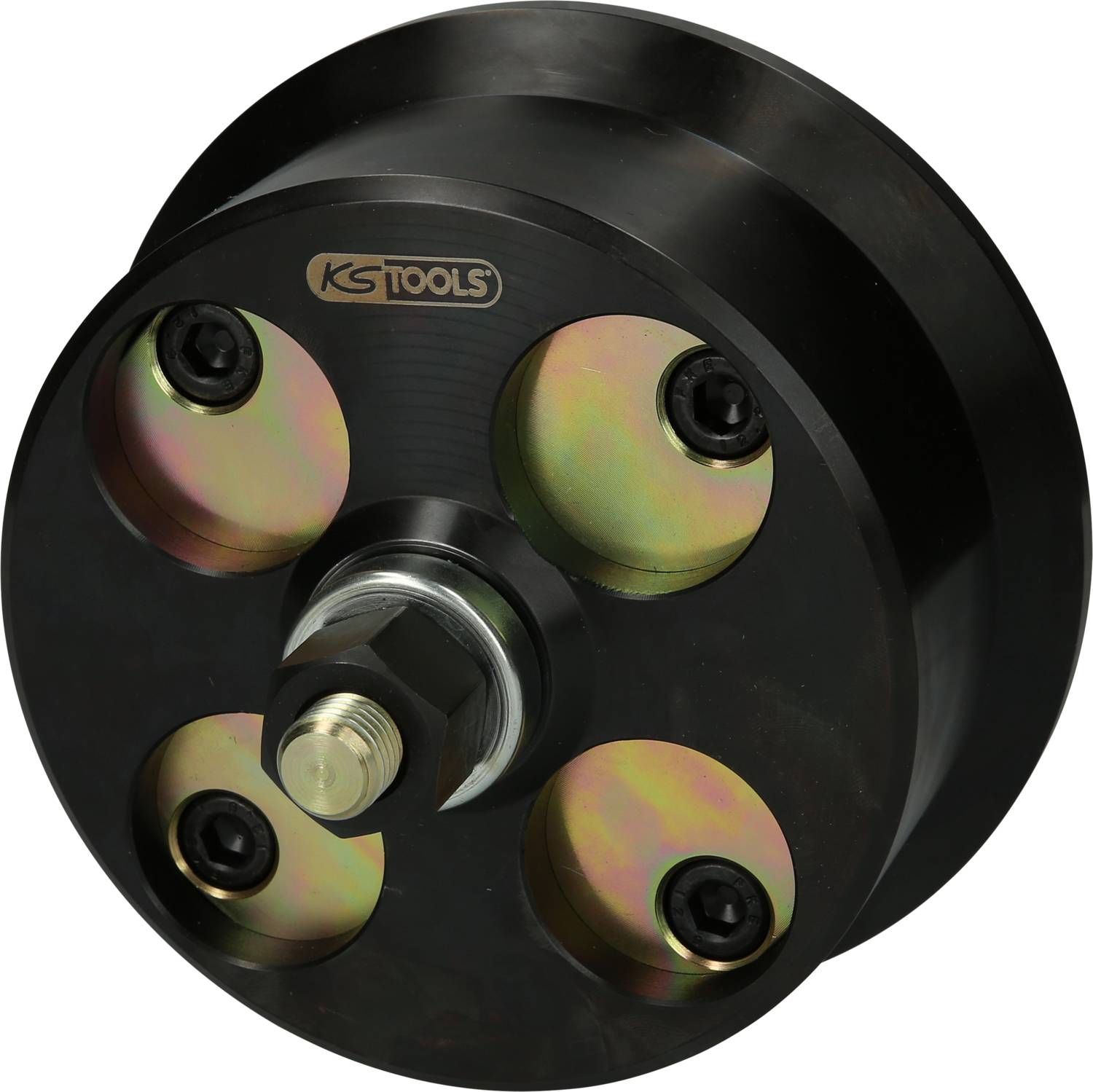 A black, round tool from KS Tools with four visible screws and a central hexagonal nut, suitable for mechanical applications.