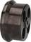 A dark, metallic wheel with four large holes that could be part of a machine component.