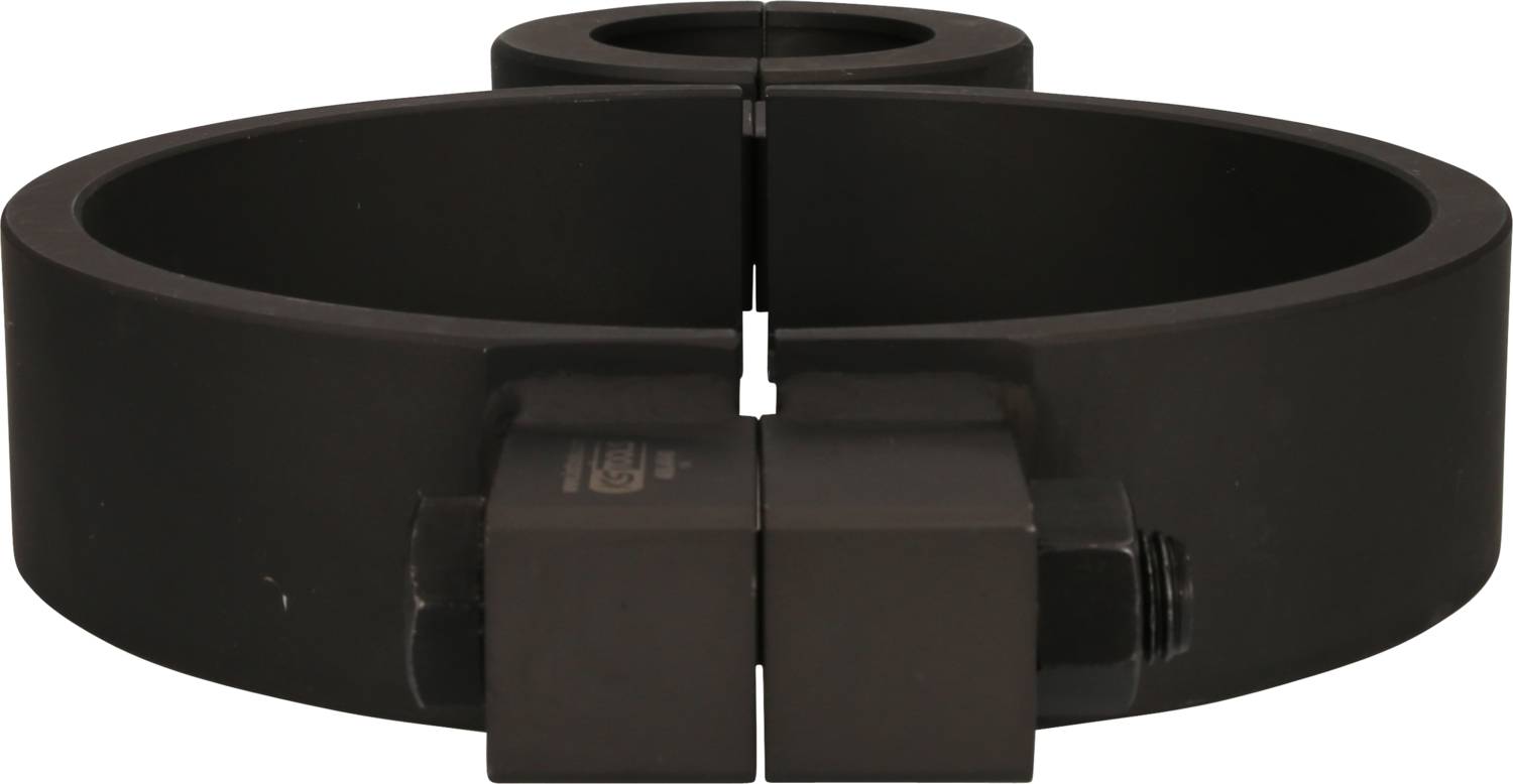 Two black, round metal parts with a screw in the centre, connect and lock together.