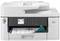 A white-grey multifunction printer is printing a coloured document with diagrams. The control panel displays menu options.