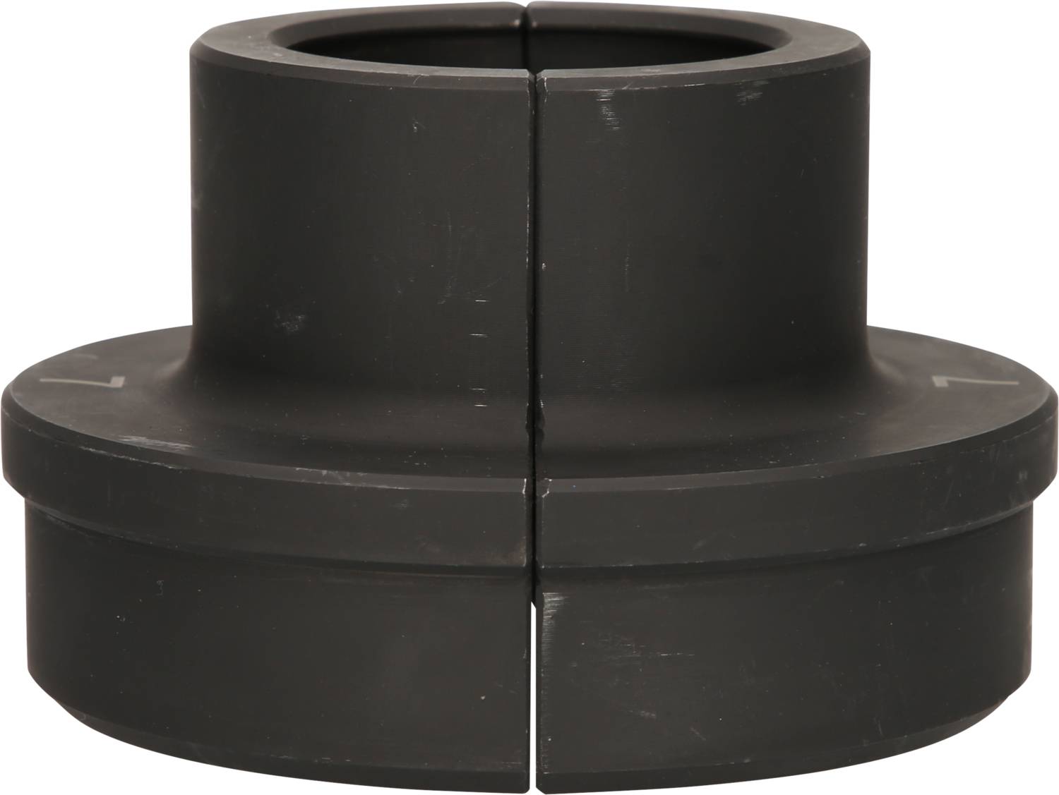 A round, black coupling ring, divided into two halves, shows lateral grooves for connecting machine components.
