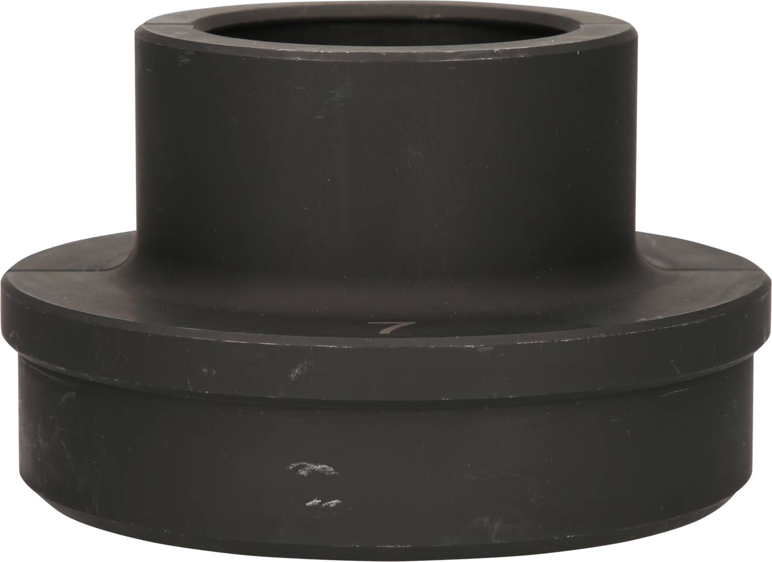 Black, cylindrical plastic part with a wide rim. It appears to be a connector or cap with no visible openings.
