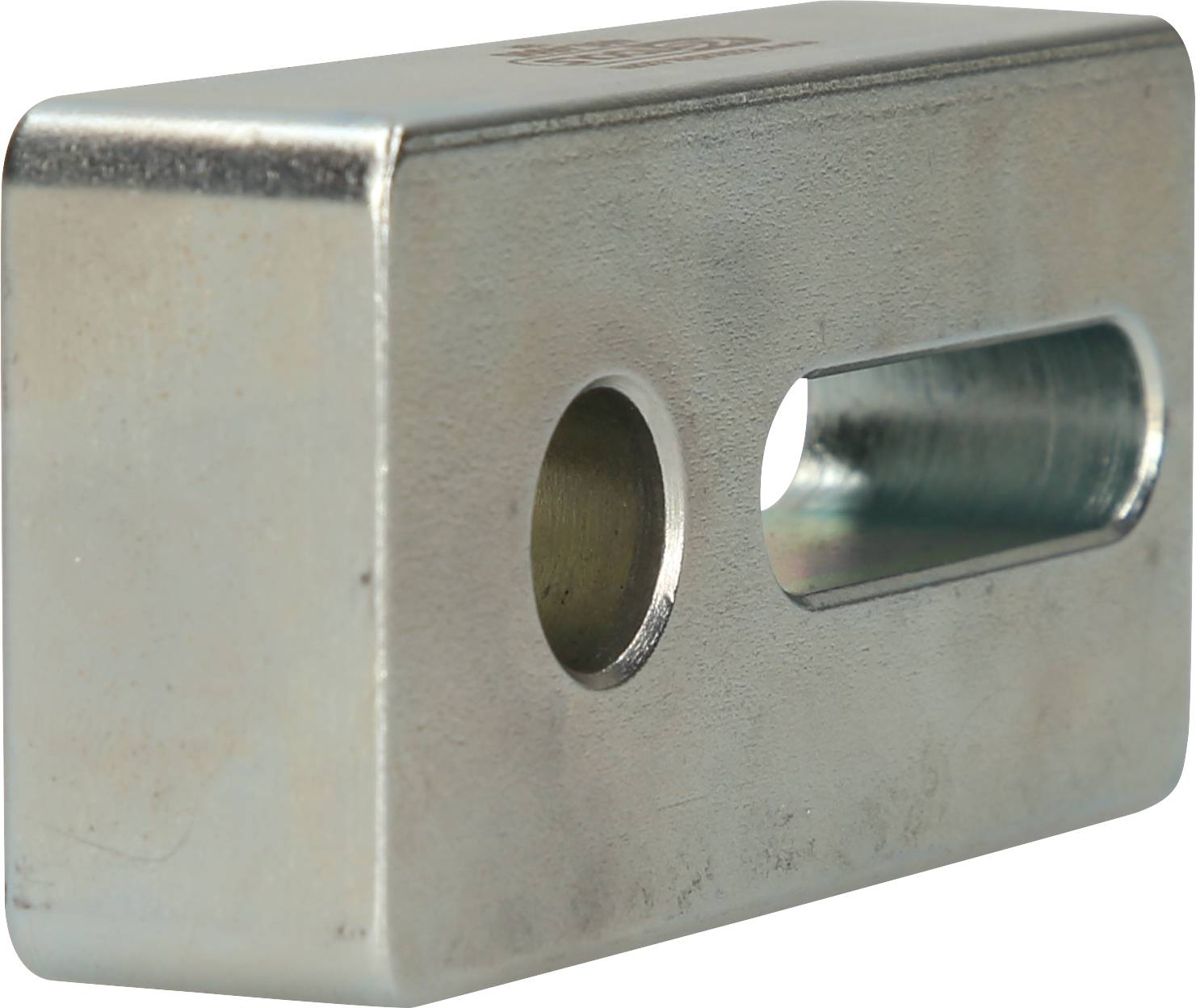 Metal block with two holes: one round hole and one elongated hole.