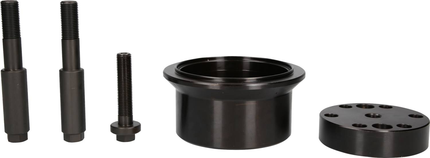 Five-piece set of mechanical components made from black metal, comprising bolts, a bush and a plate with holes.