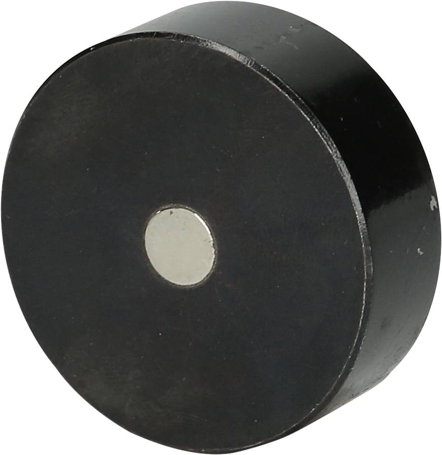 Black, round magnet with a silver surface in the centre on a neutral background.