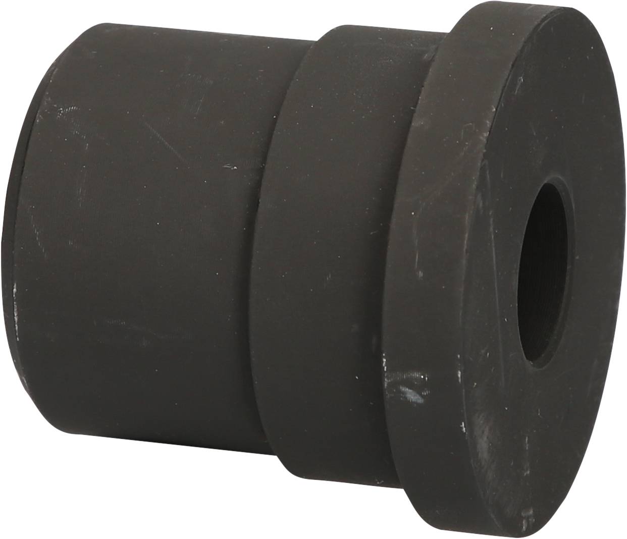 Black, cylindrical rubber component with a hole in the centre, potentially a damping element or seal for machinery.