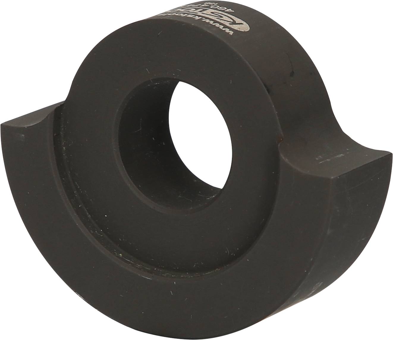 Circular, black metal component with a central hole and lateral protrusions, potentially a machine part.