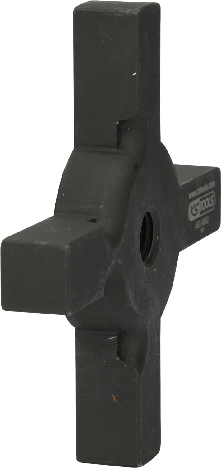 A black tool with four equally sized, block-shaped extensions and a central hole.