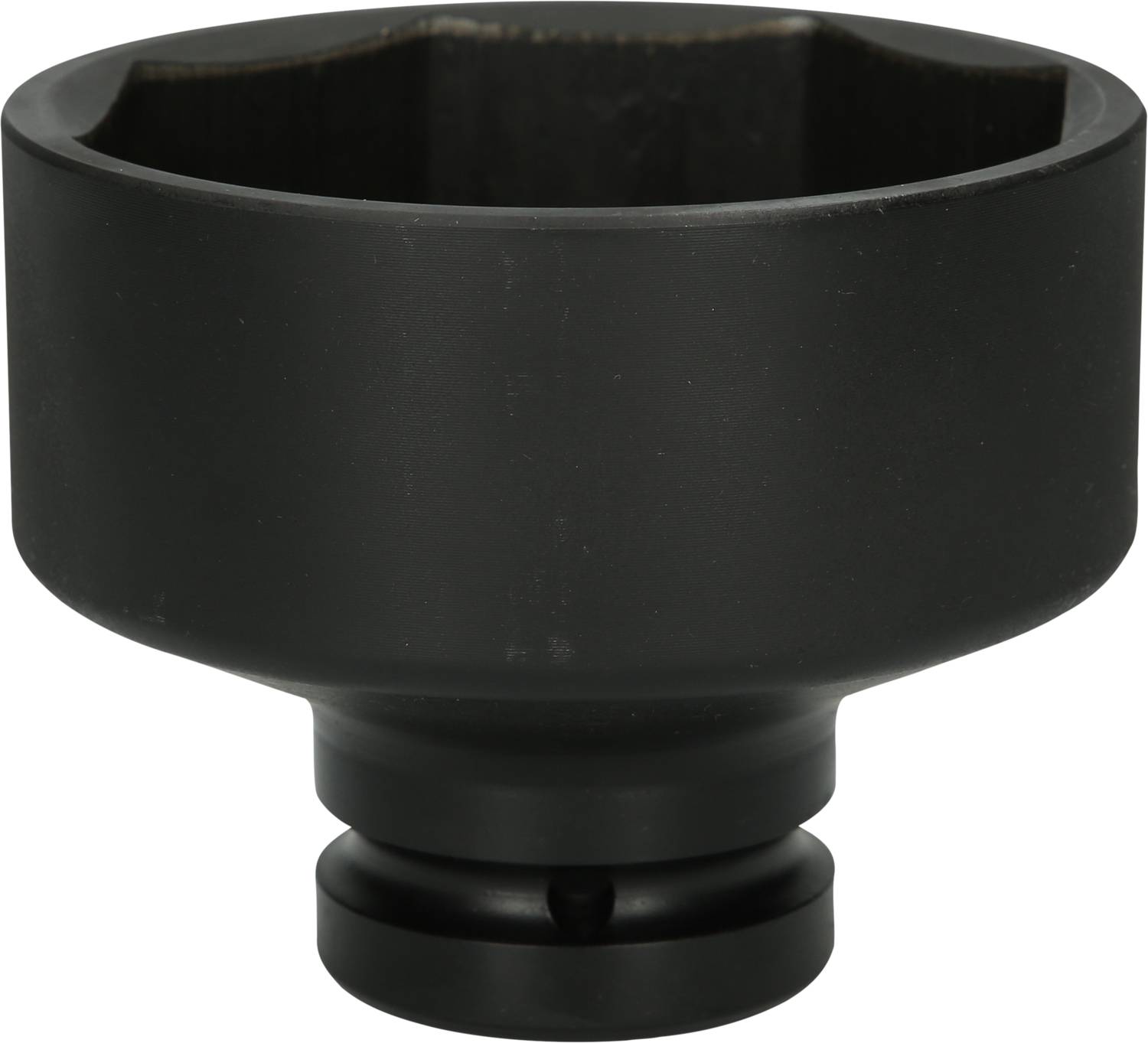 A black, cylindrical metal attachment with a hexagonal opening, possibly a tool component, on a white background.