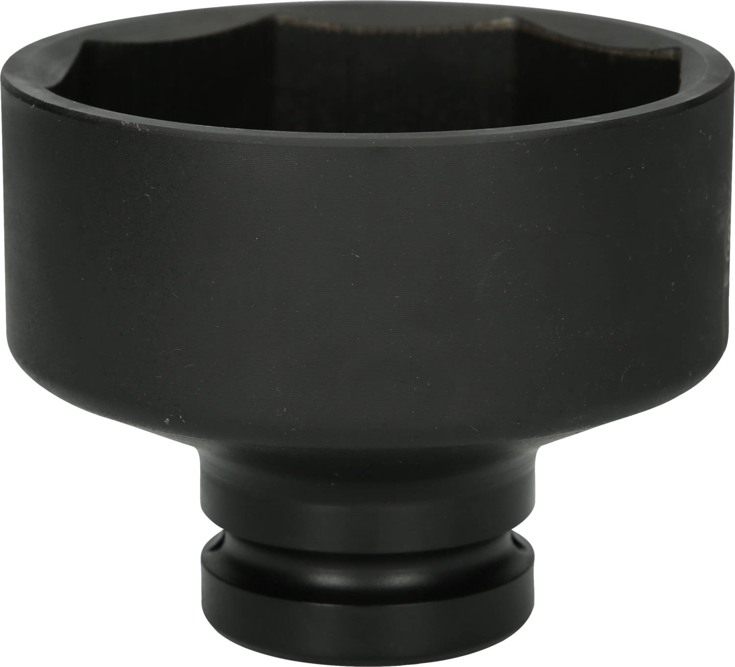A black, cylindrical metal adapter with a flat bottom and open top, possibly a machine part or attachment.