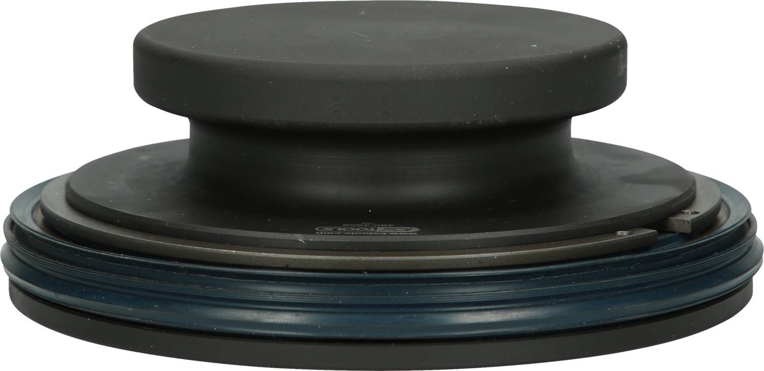 A round, black doorstop on a white surface.