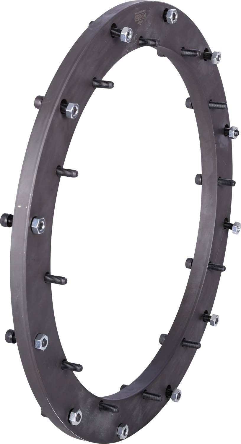 A large, round metal ring with several screws and bolts evenly distributed around the edge.