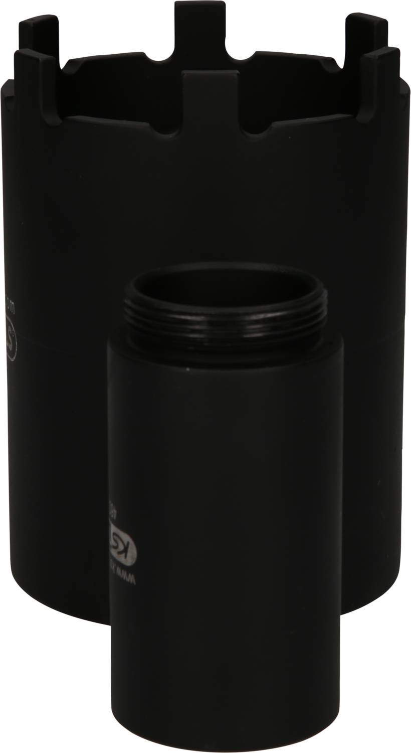 A black cylindrical container with a screw lid, positioned in front of another, larger cylindrical object.