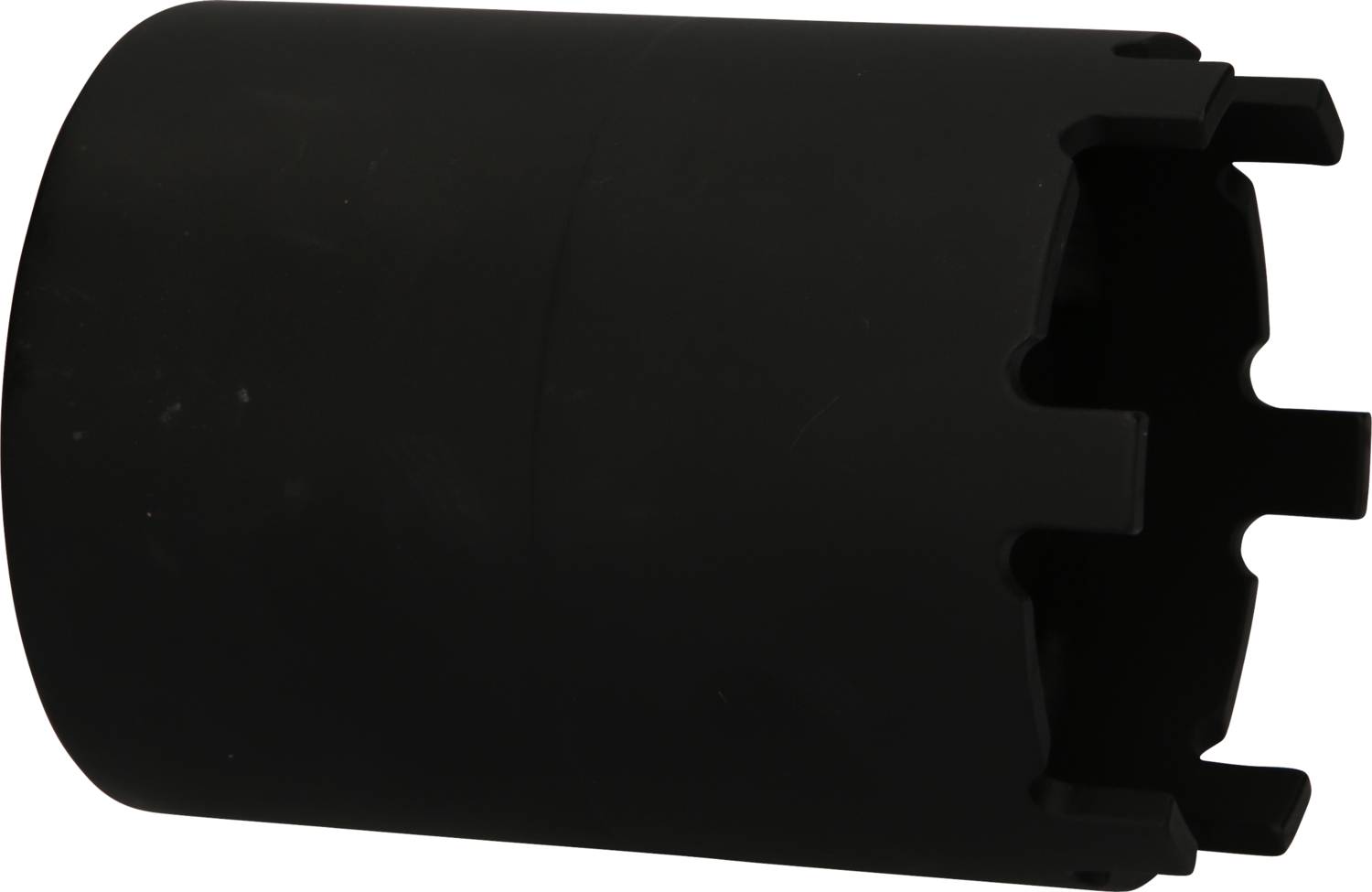 A black cylindrical object with multiple grooves at one end, placed on a white background.