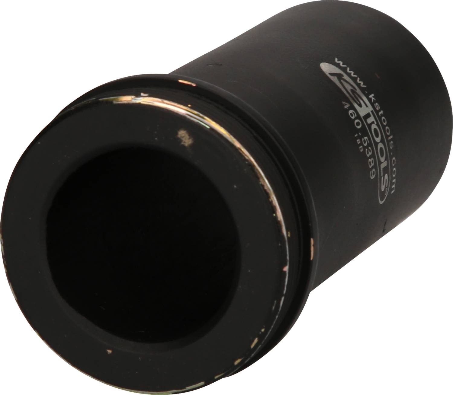 A black metal cylinder with the inscription 'www.kitools.com'. It has a smooth edge and is slightly bevelled.