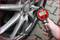 'Digital tyre pressure measurement on a car tyre using a pressure gauge'