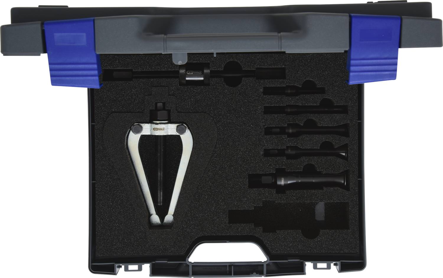'Open black tool case with black foam lining. Contains a puller and various adapter attachments.'