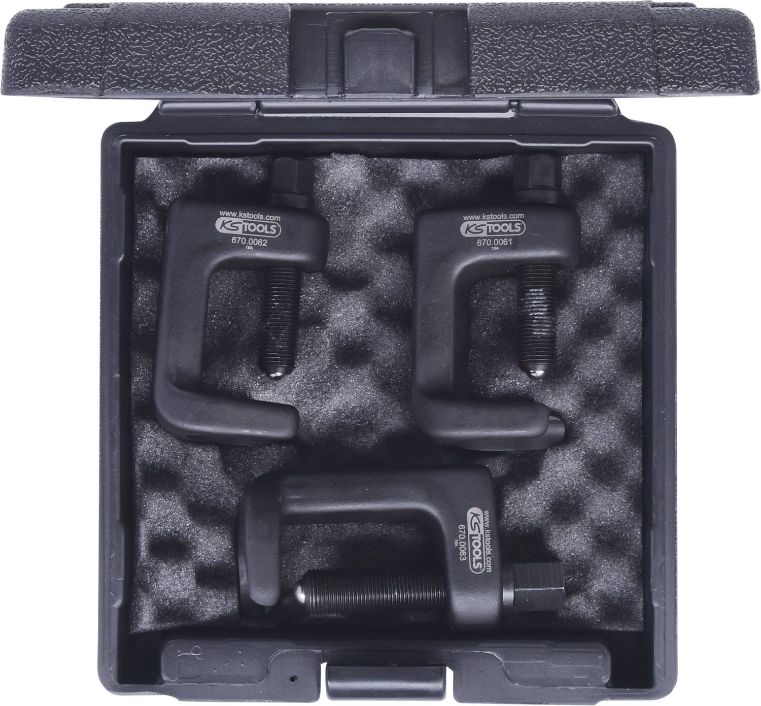 Three black G-clamps arranged in a case with foam lining. Case open, clamps of varying sizes visible.