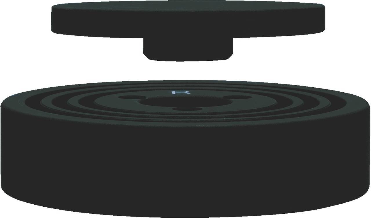 Two black round discs, one hovering above the other, likely parts of a magnetic or mechanical system.